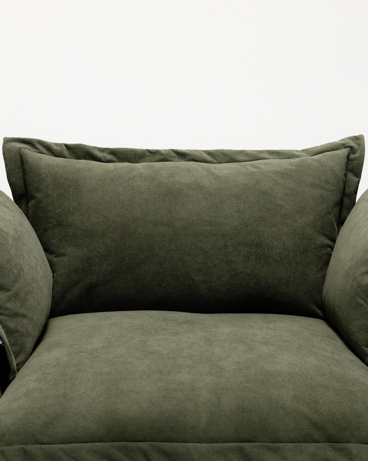 green cushion sofa