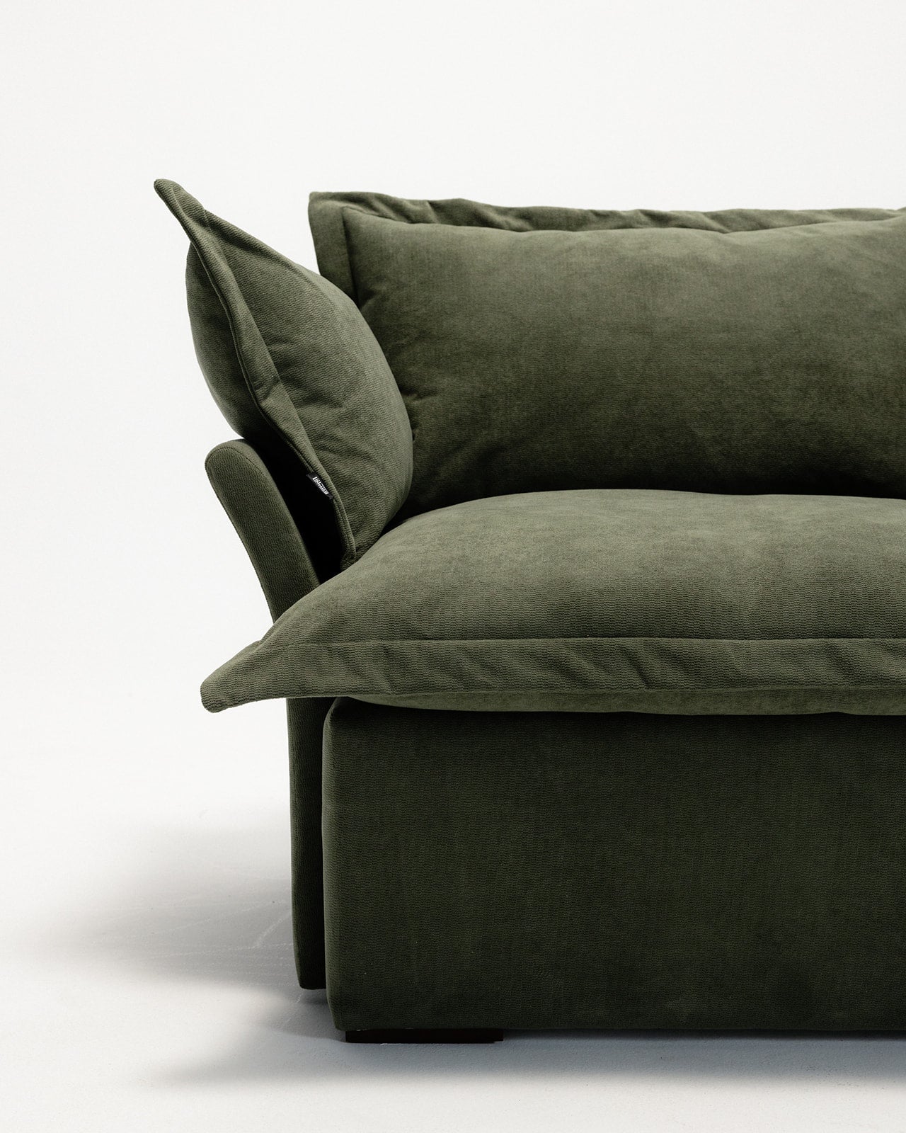 olive green sofa with cushions